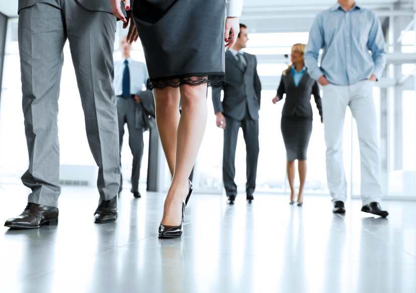 Group of successful businesspeople entering the building.