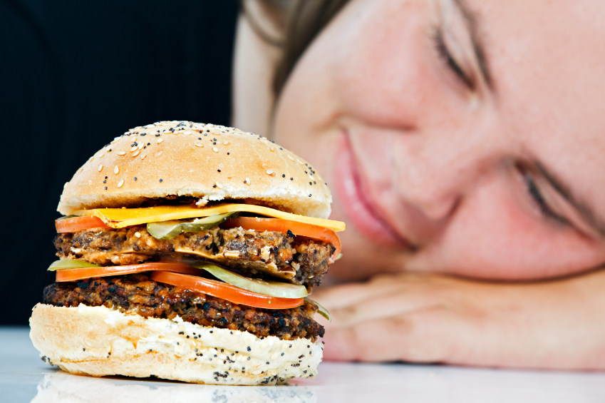 Woman staring hamburger