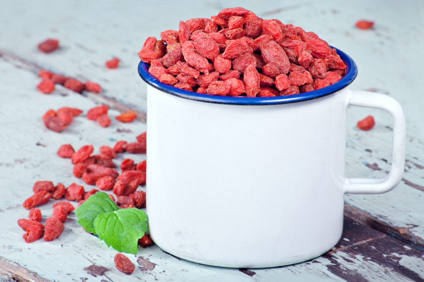 Goji berries on a wooden background