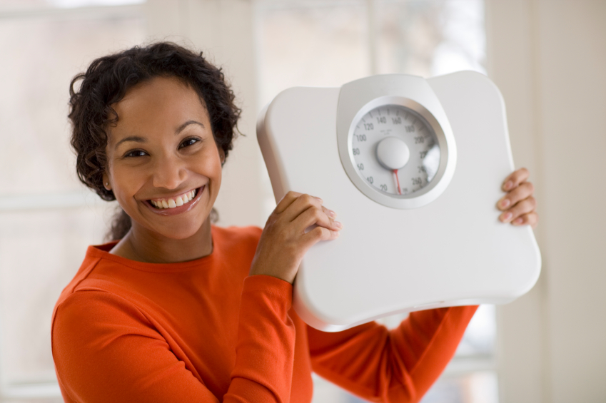 Woman holding scale