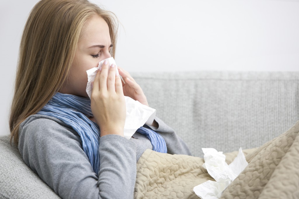 sneezing woman